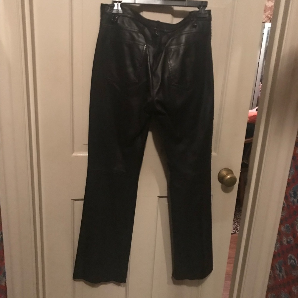 Black leather flared pants with braided seam on sides from Saks fifth ave